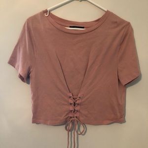 Pink scrip top with lace up detail